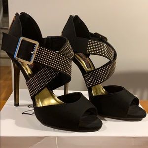 Black and gold open toe heels